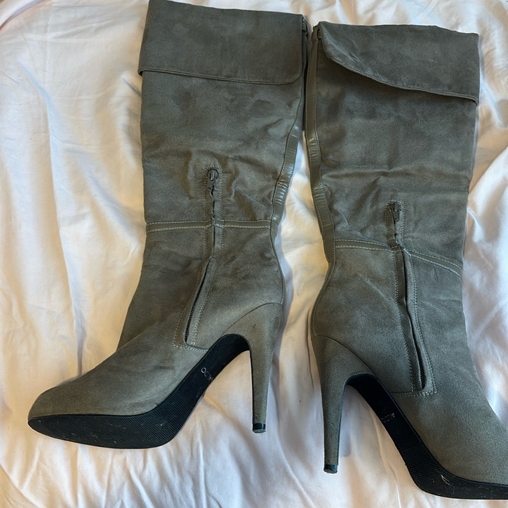 Previously loved knee high boots with zipper.